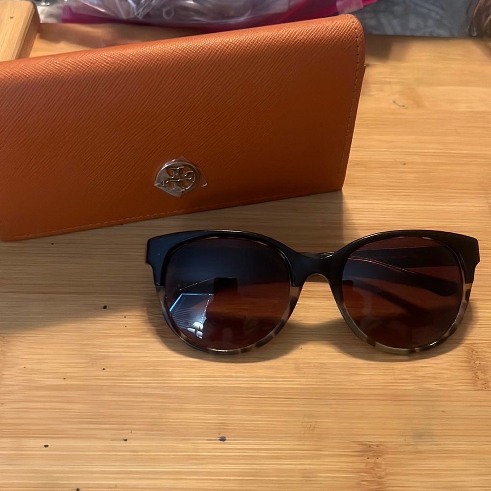 Tory Burch tortoiseshell sunglasses.